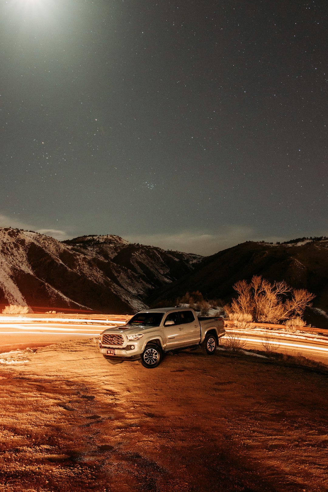 silver suv on road during night time