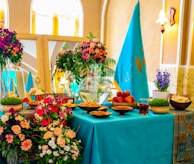 A joyful celebration scene with flowers adorning a table.