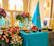 A beautifully arranged catering table with colorful nomadic dishes and elegant decorations.