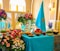 A beautifully arranged table featuring colorful, missile-shaped food items and gifts.