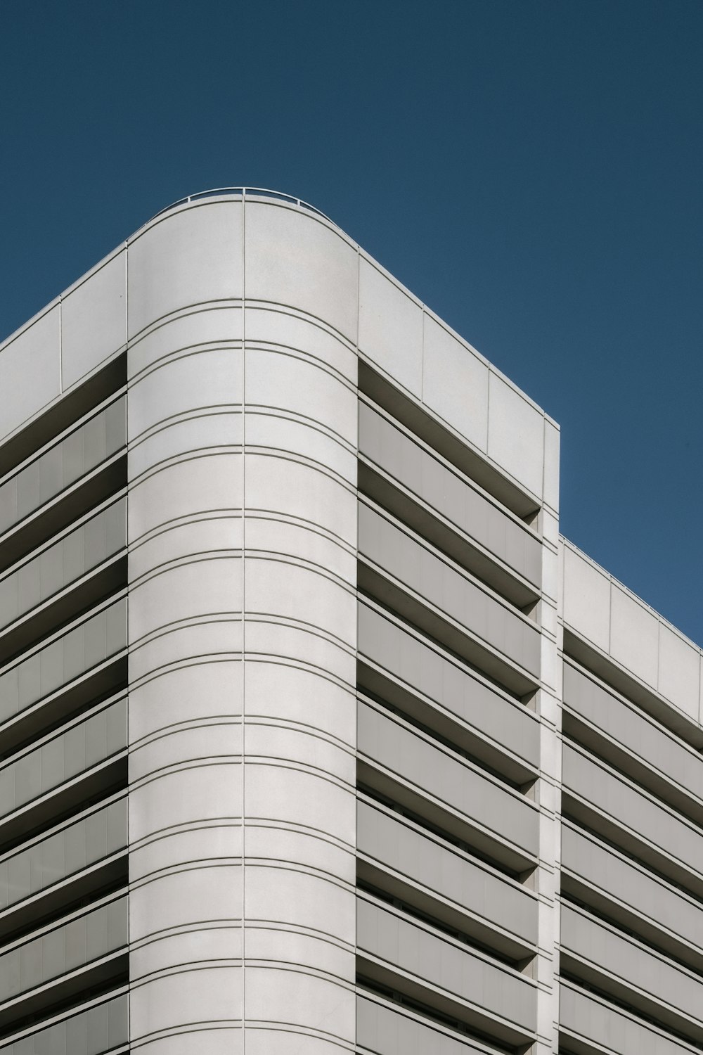 white concrete building under blue sky during daytime