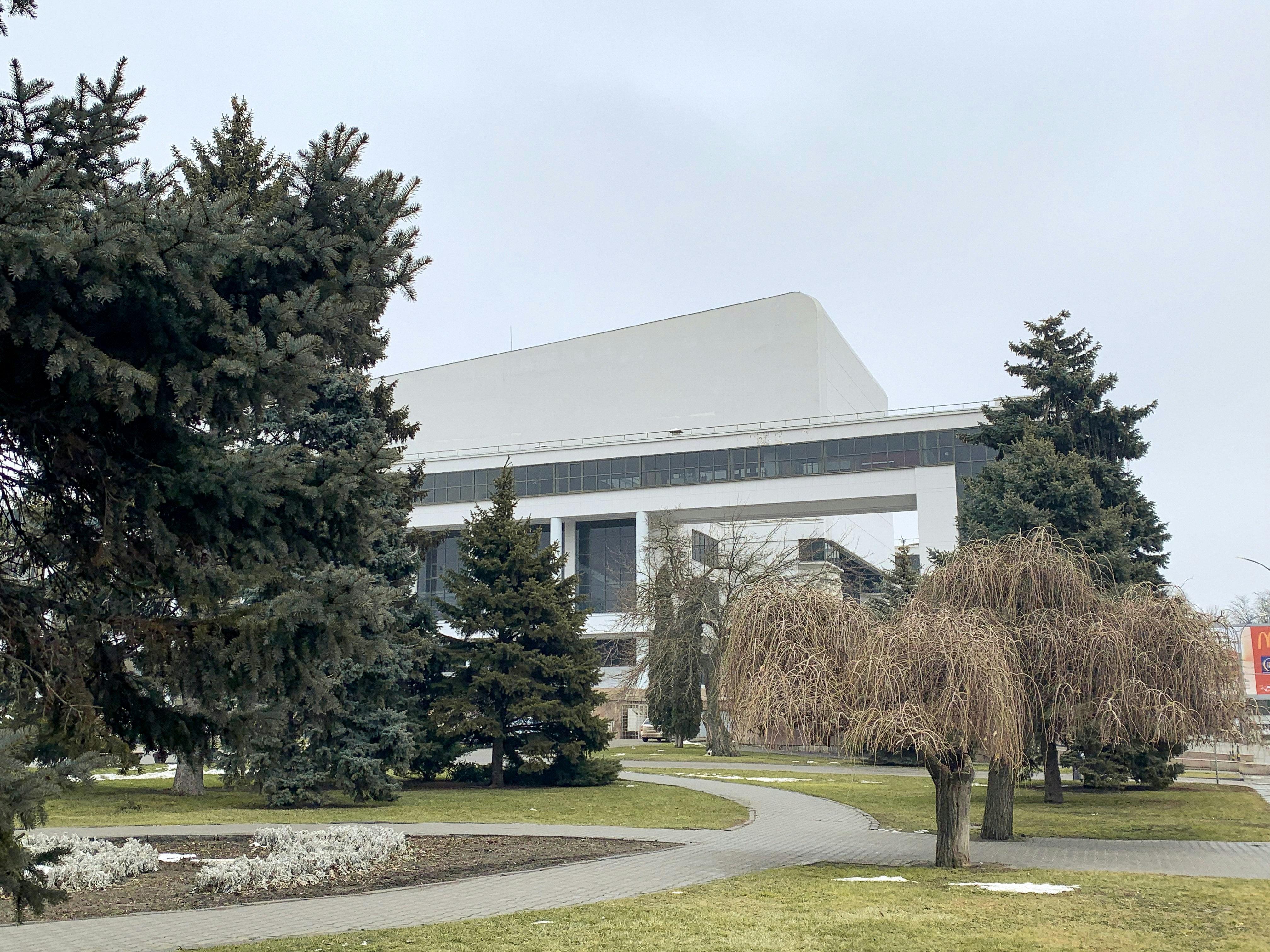 green trees near white building during daytime