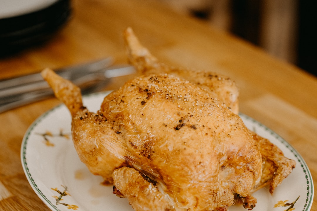 roasted chicken on white ceramic plate,