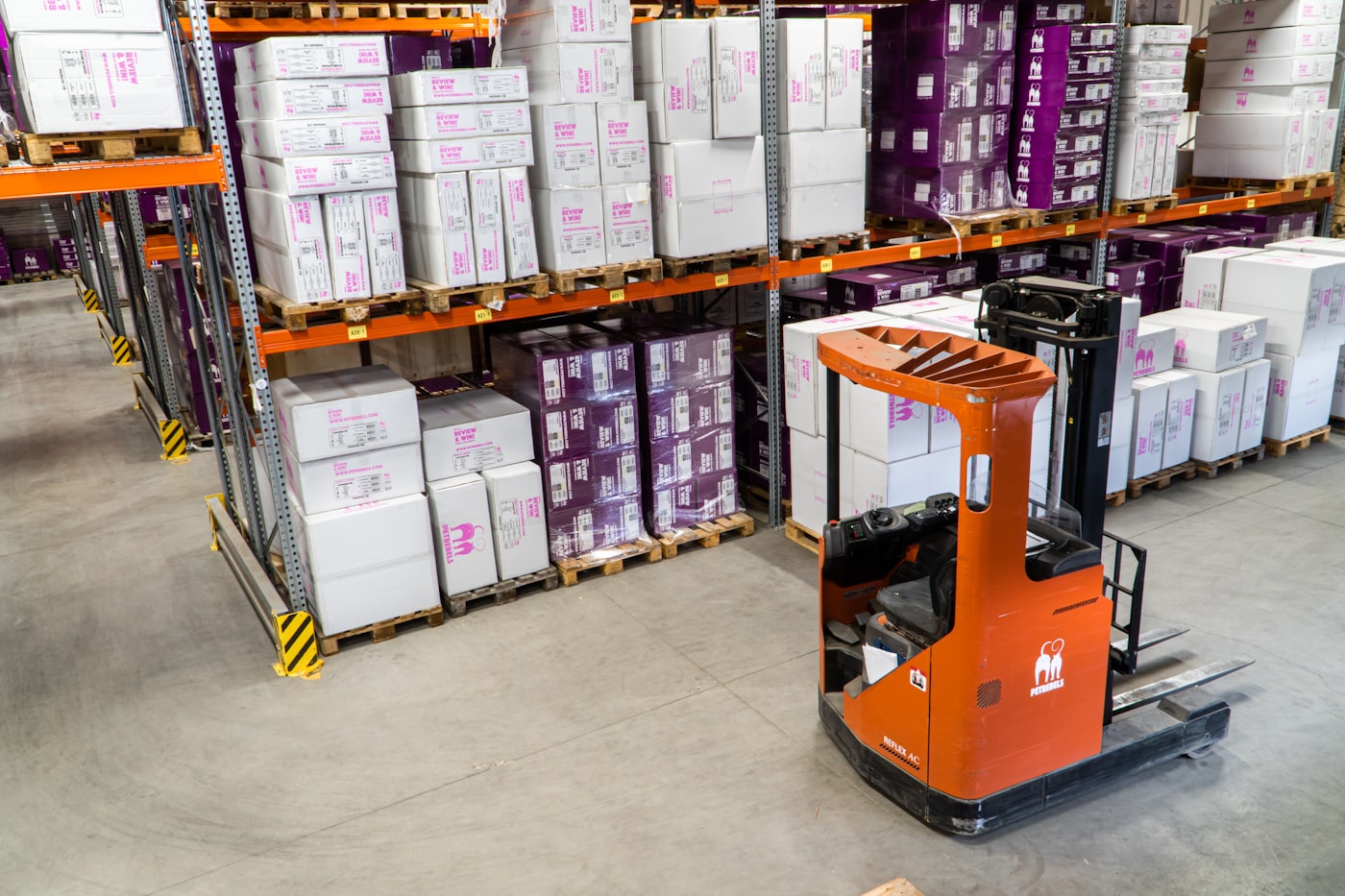 Electric forklift in industrial warehouse