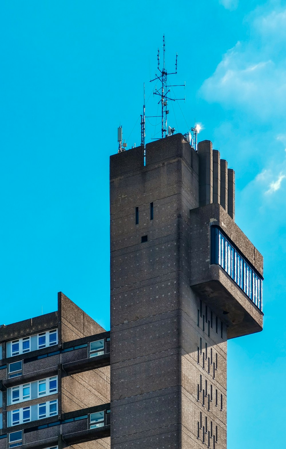 brown concrete building under blue sky during daytime