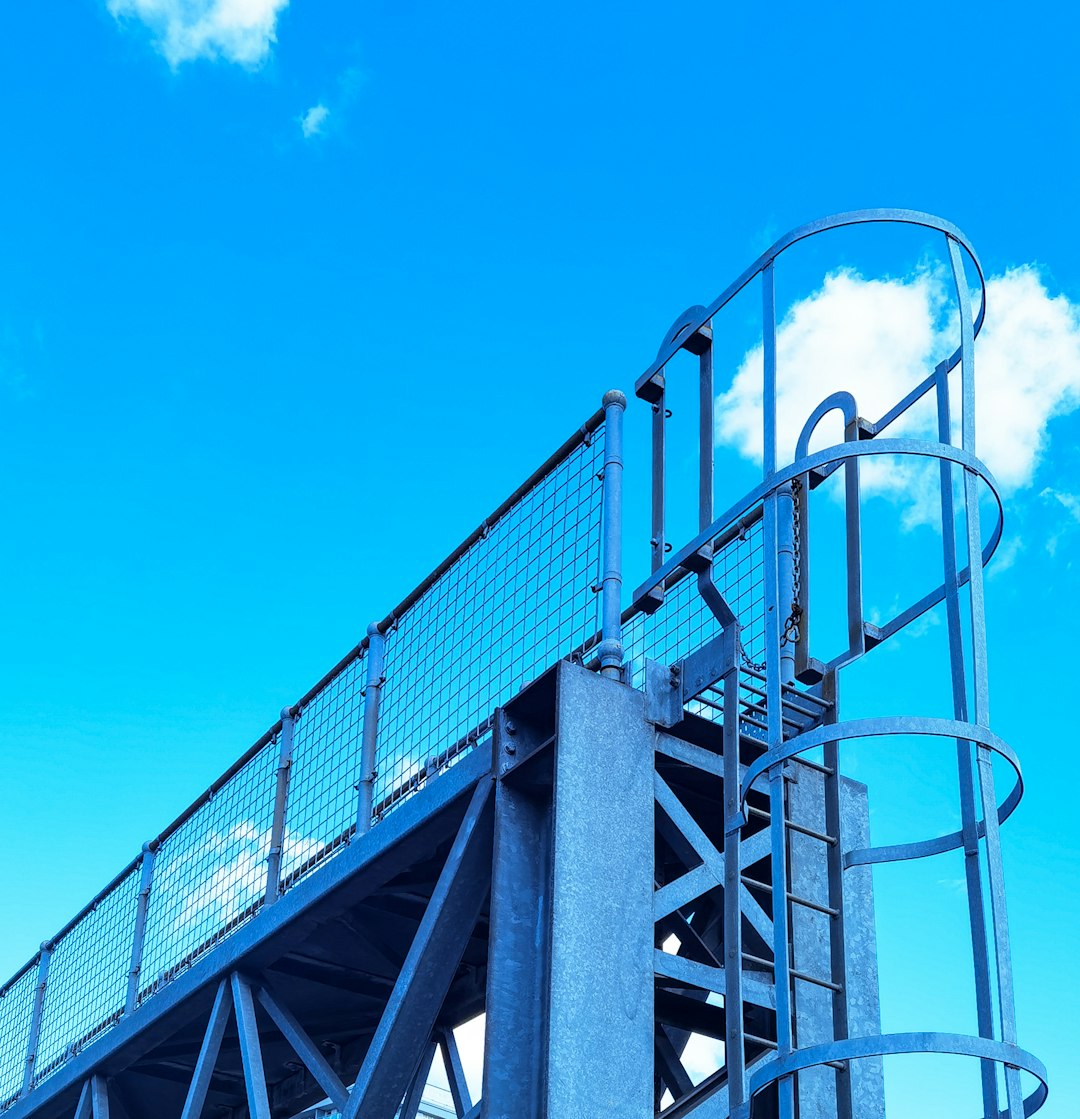 stainless steel railings on blue sky during daytime