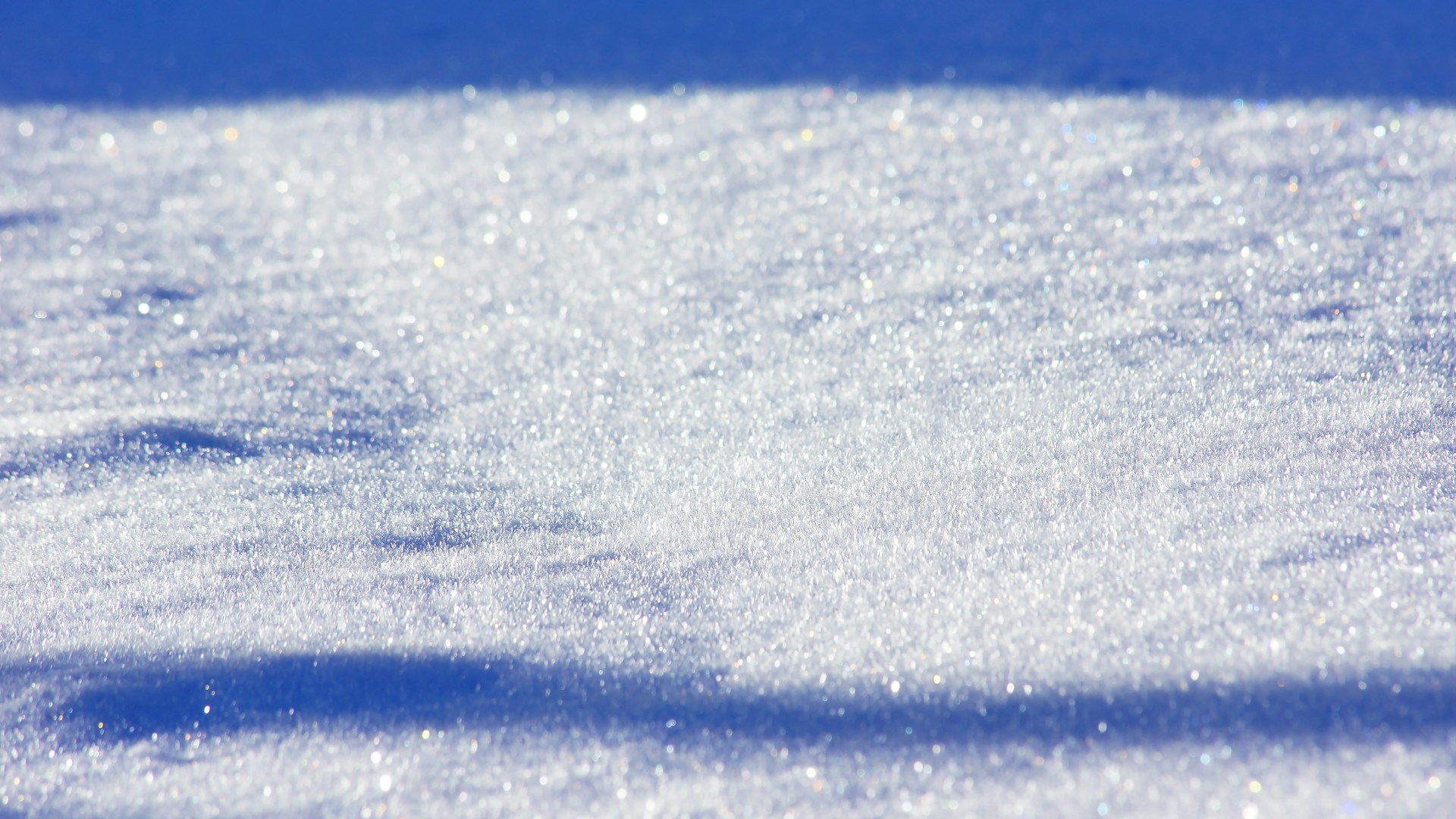 white snow on blue background