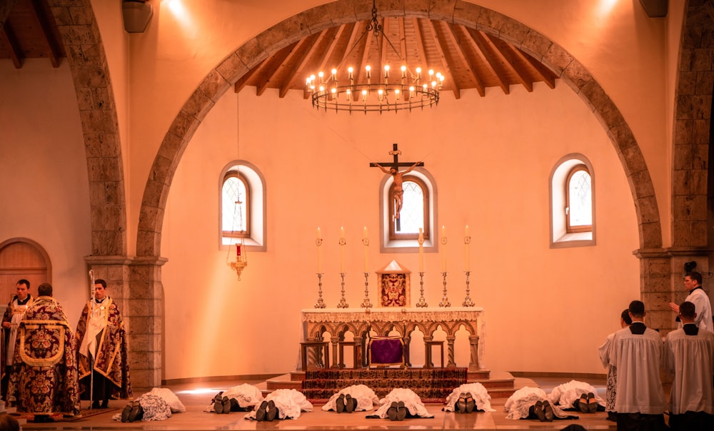 people sitting on chairs inside church