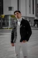 Model wearing a sharp, minimalist mogul status jacket against an urban backdrop.
