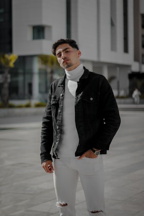 Model wearing a sharp, minimalist mogul status jacket against an urban backdrop.