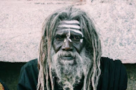 man in black shirt with black and white face paint
