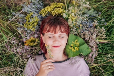 woman in gray crew neck shirt lying on green grass inspired google meet background