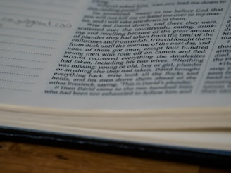 A close-up of an open book with highlighted text and notes.