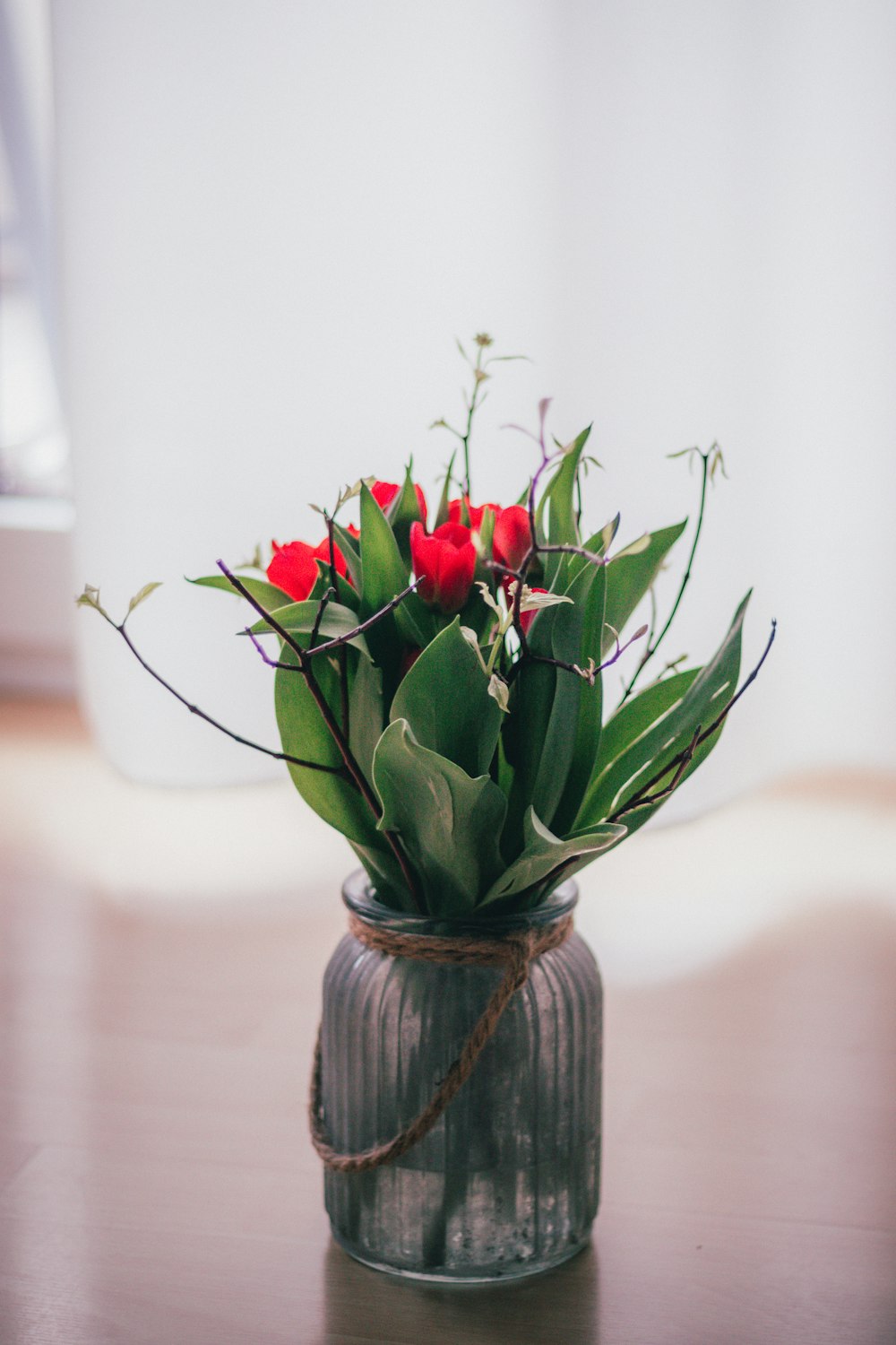 red roses in glass vase