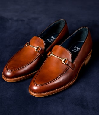 brown leather loafers on blue textile
