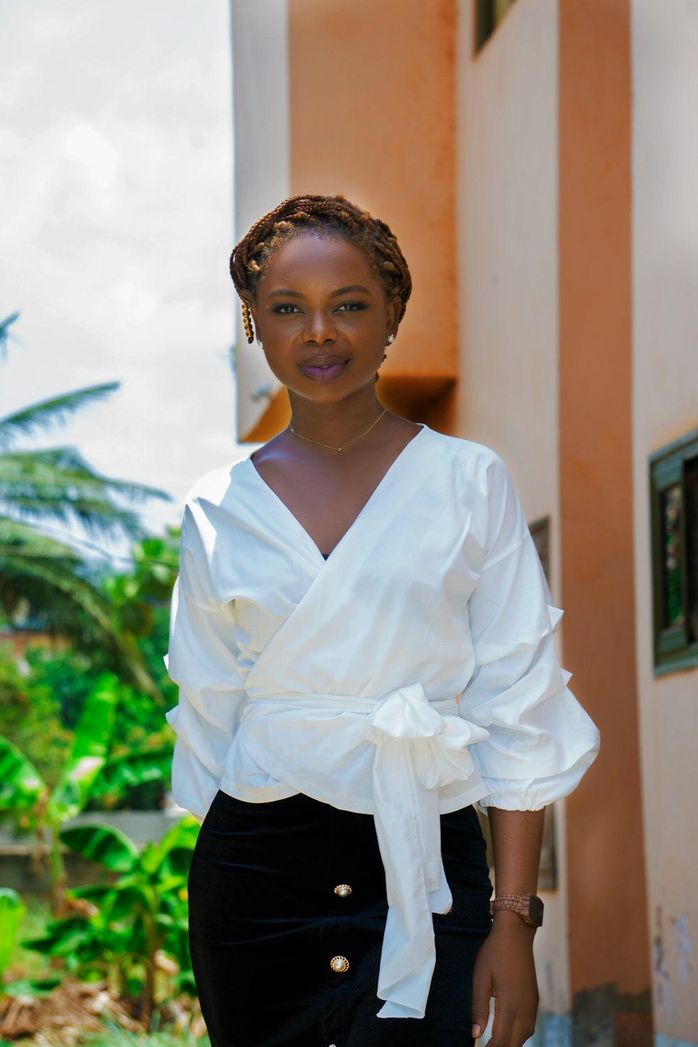 woman in white dress shirt and black skirt