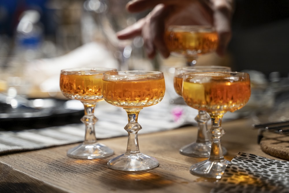 clear wine glass with brown liquid