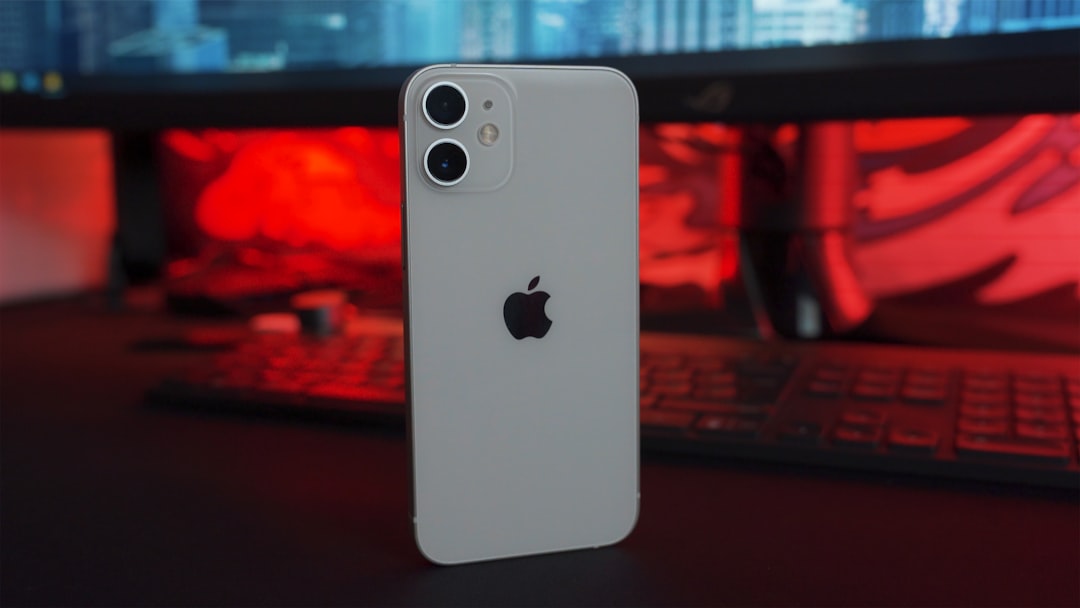 white iphone 5 c on table, Apple iPhone 12 mini on the table