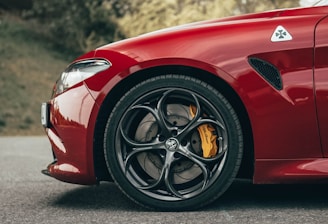 red ferrari 458 italia on road during daytime