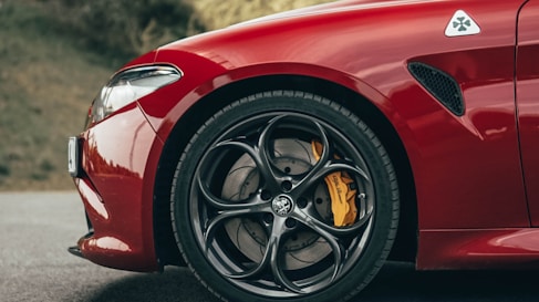 red ferrari 458 italia on road during daytime