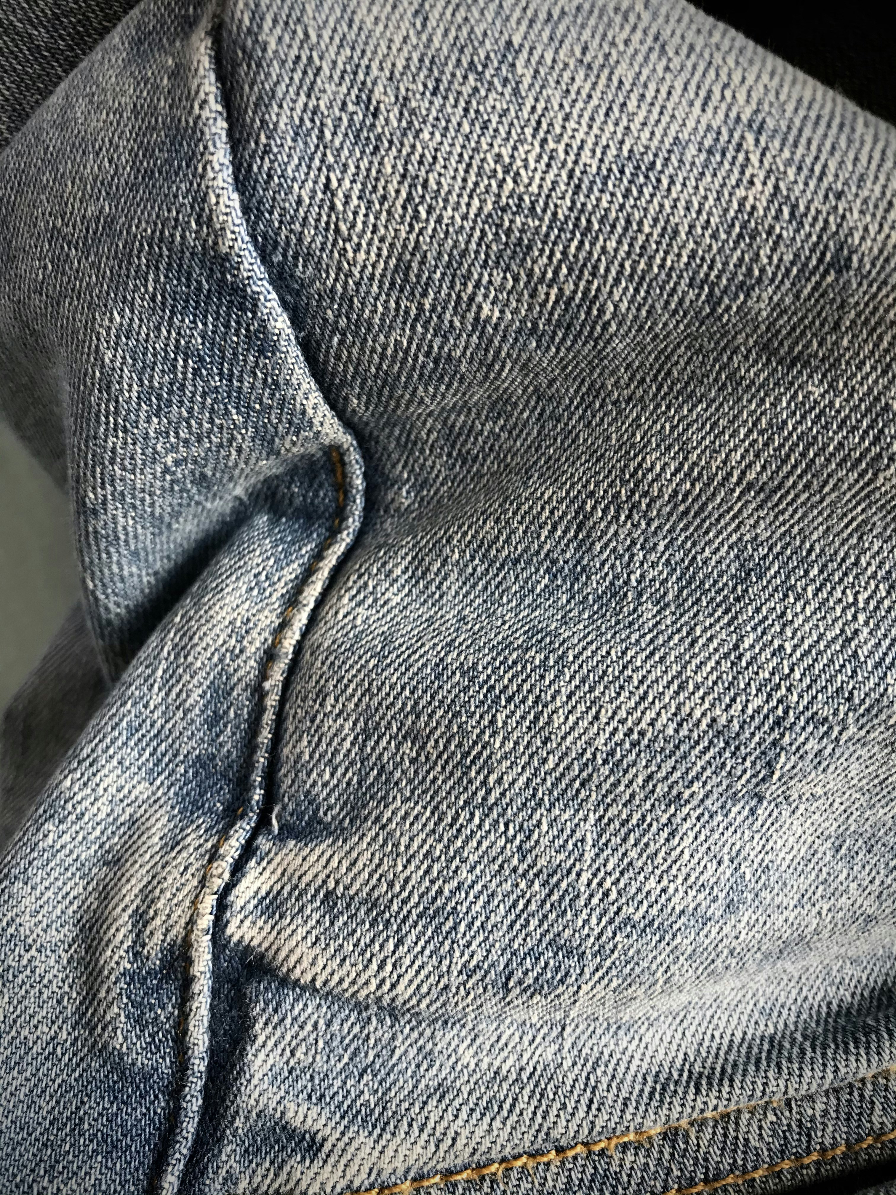 person in blue denim jeans