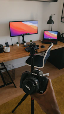 A candid photo of a creative workspace with sketches, a laptop, and coffee, reflecting the energy behind Canon Evnt.