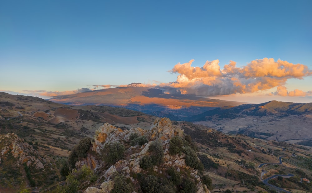 green and brown mountains under blue sky during daytime