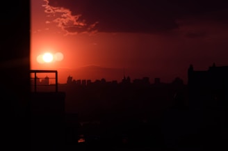 A dramatic scene showcasing a city skyline at sunset with digital effects.