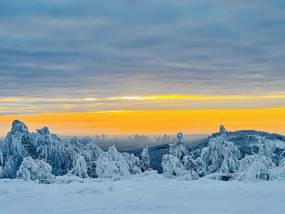 snow covered mountain during sunset