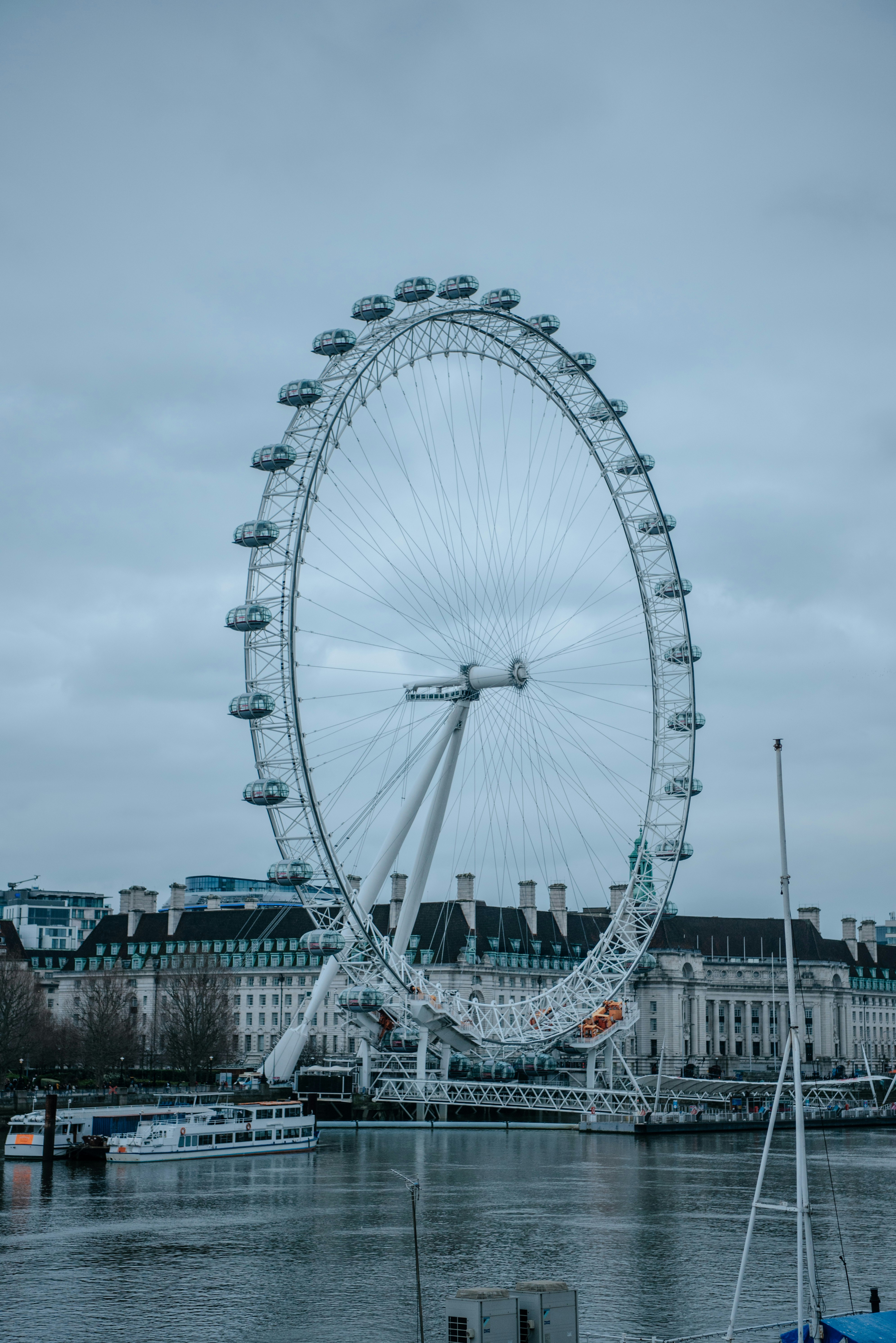 white ferris wheel under white sky during daytime