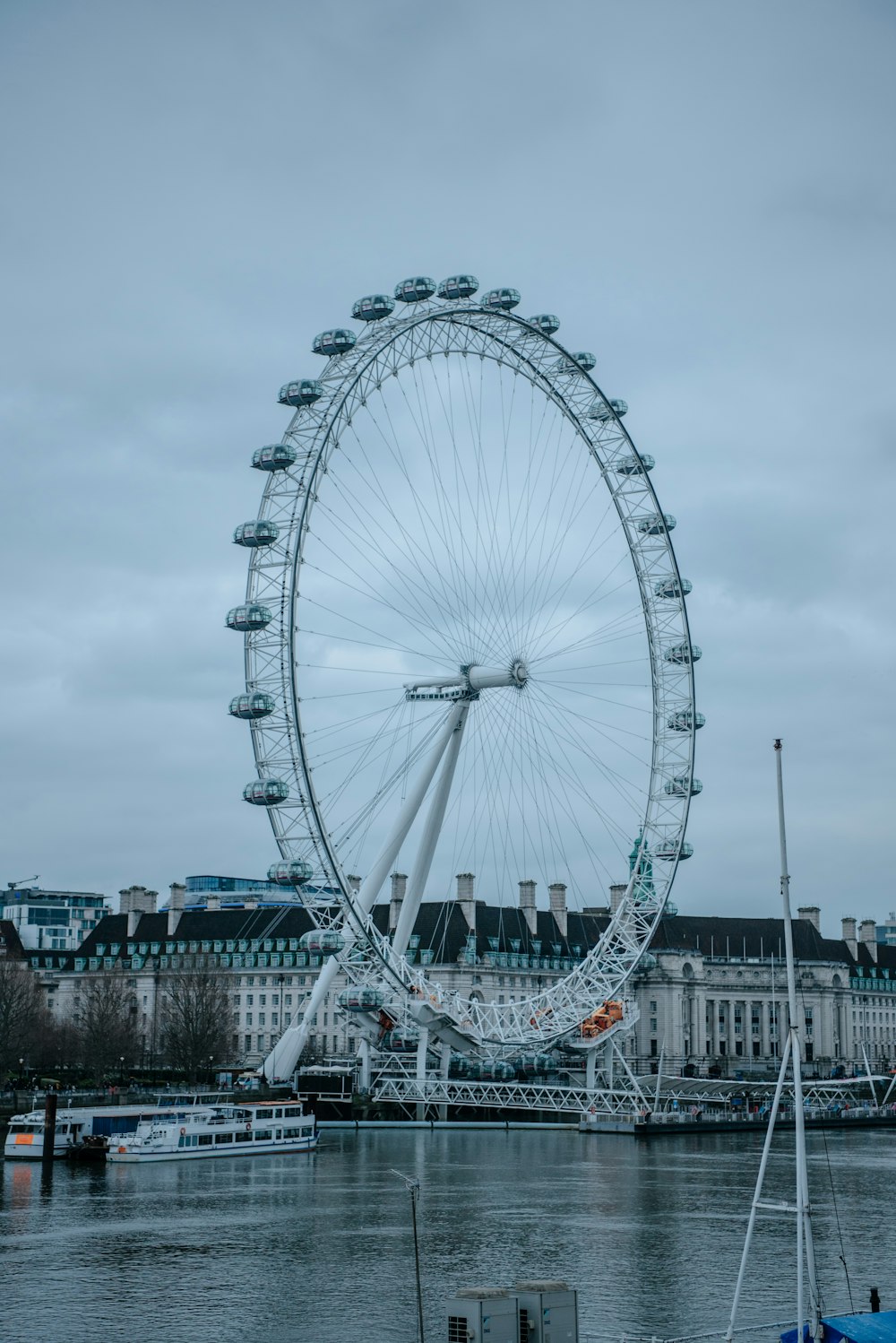 white ferris wheel under white sky during daytime