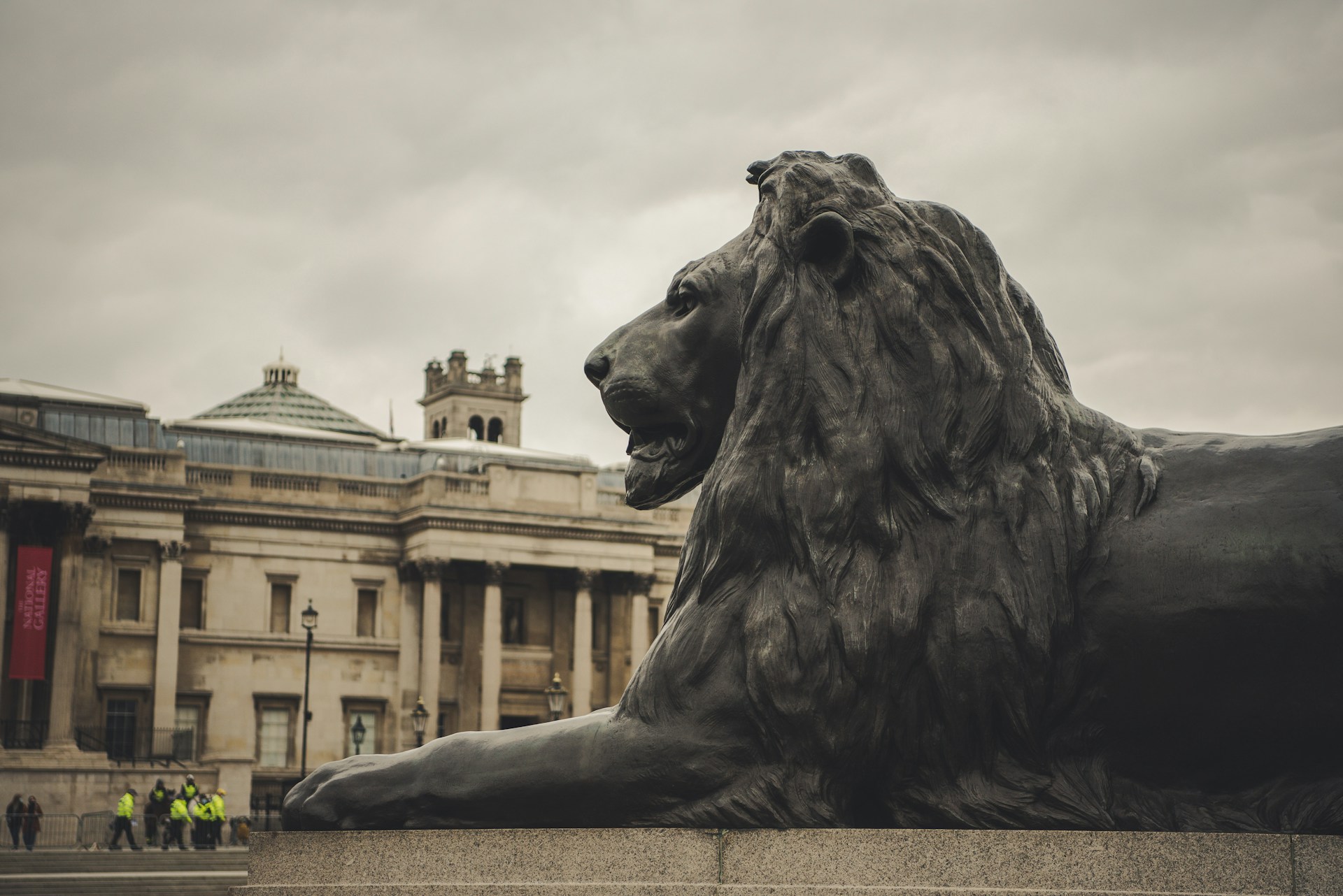 gray lion statue near building