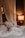 A peaceful bedroom scene with soft lighting.