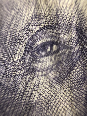 Detailed view of microtext and holographic elements embedded in a security document.