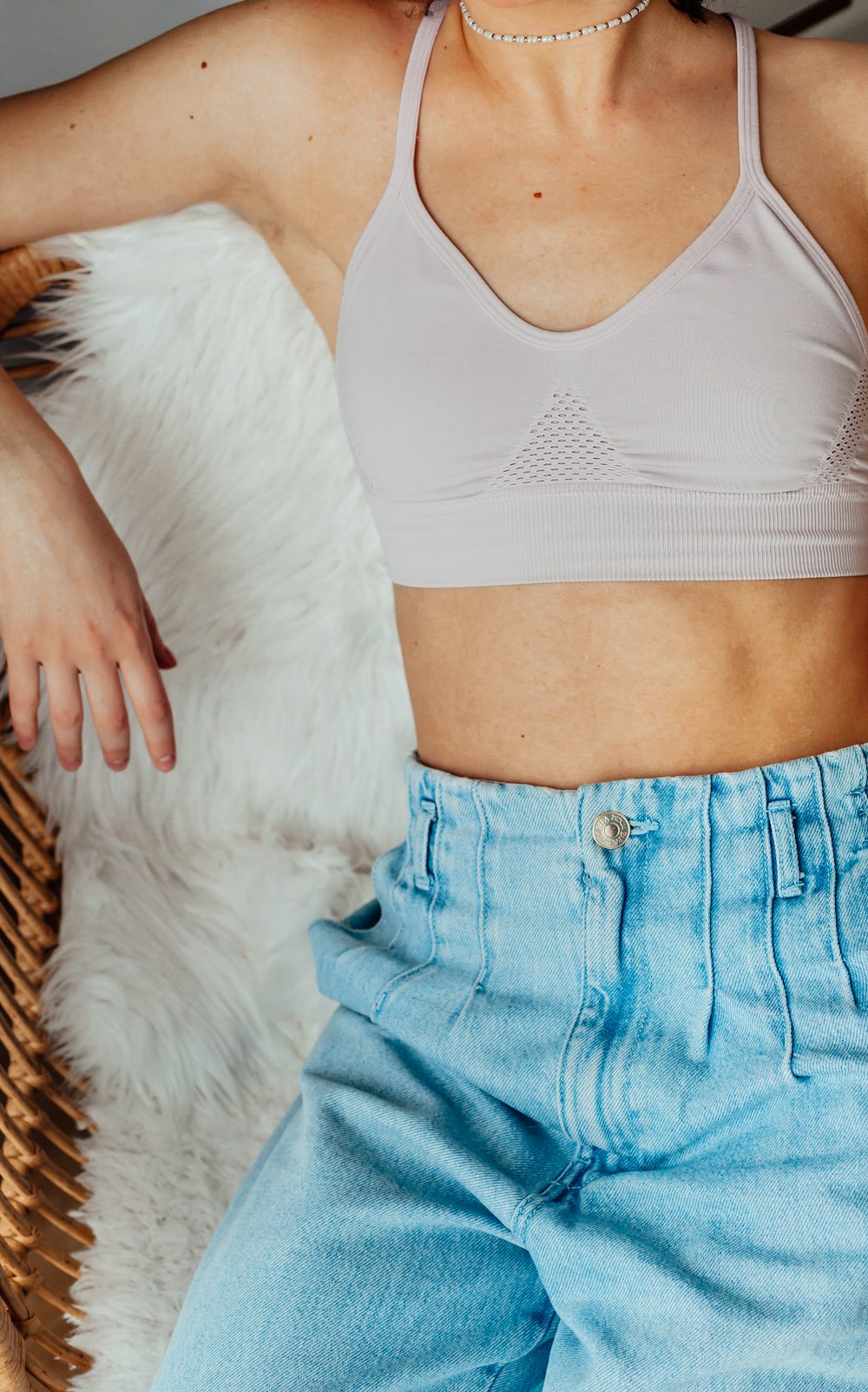 woman in blue denim jeans and white tank top