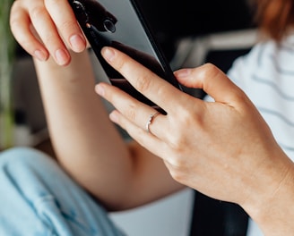 a close up of a person holding a cell phone