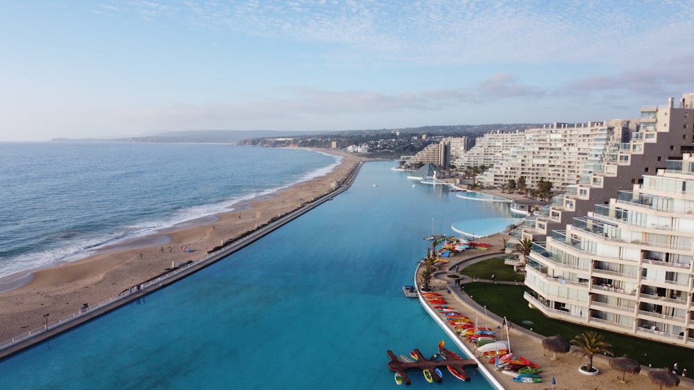 aerial view of city buildings near body of water during daytime