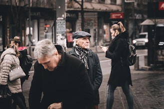 A group of friends walking together while using their phones.