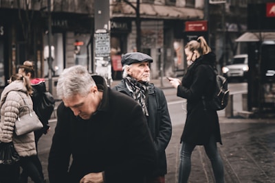 A photo of a group of people using the vote&go app in an urban setting.