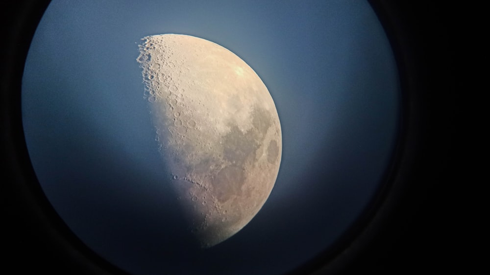 white full moon in blue sky