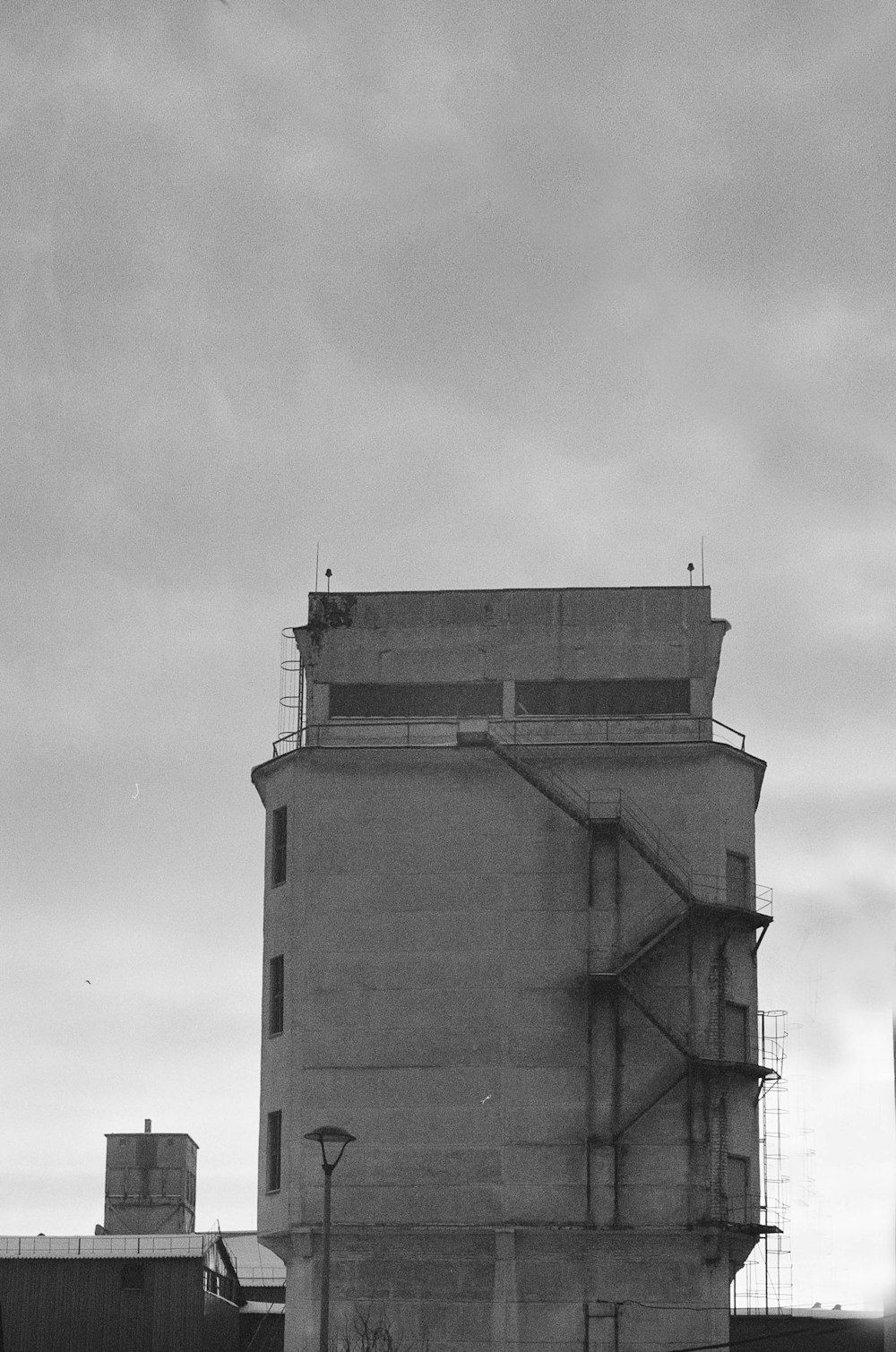 grayscale photo of concrete building