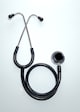 black and silver stethoscope on white surface