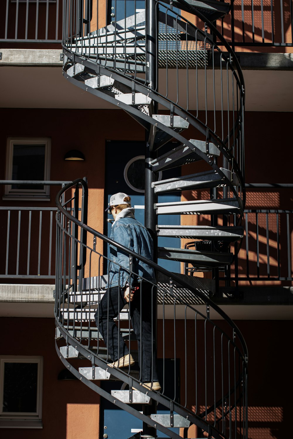 black spiral staircase with black steel railings