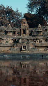 gray concrete building near body of water during daytime