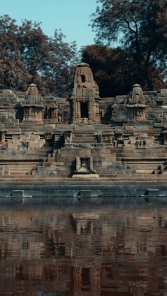 gray concrete building near body of water during daytime