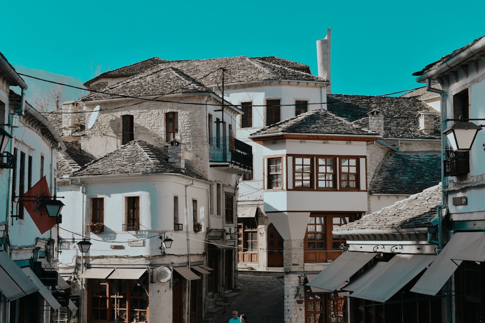 white and brown concrete houses under blue sky during daytime