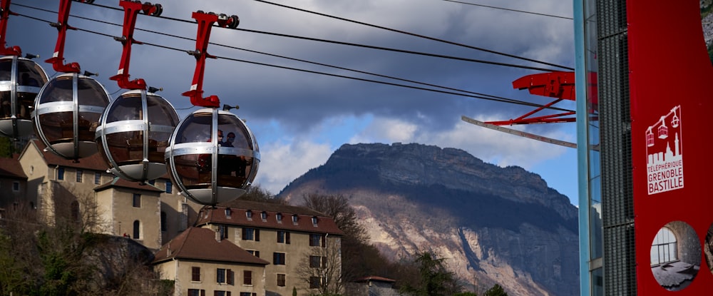 white and red cable car near brown concrete building during daytime