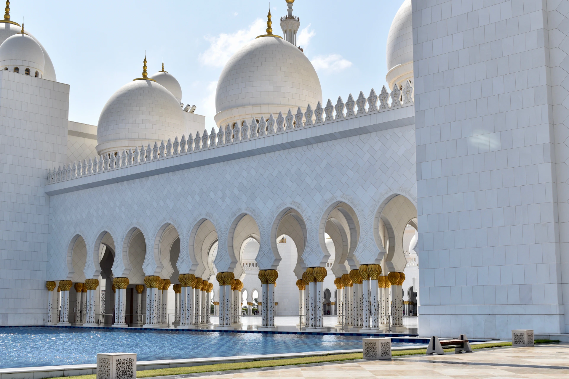 people walking near white concrete building during daytime