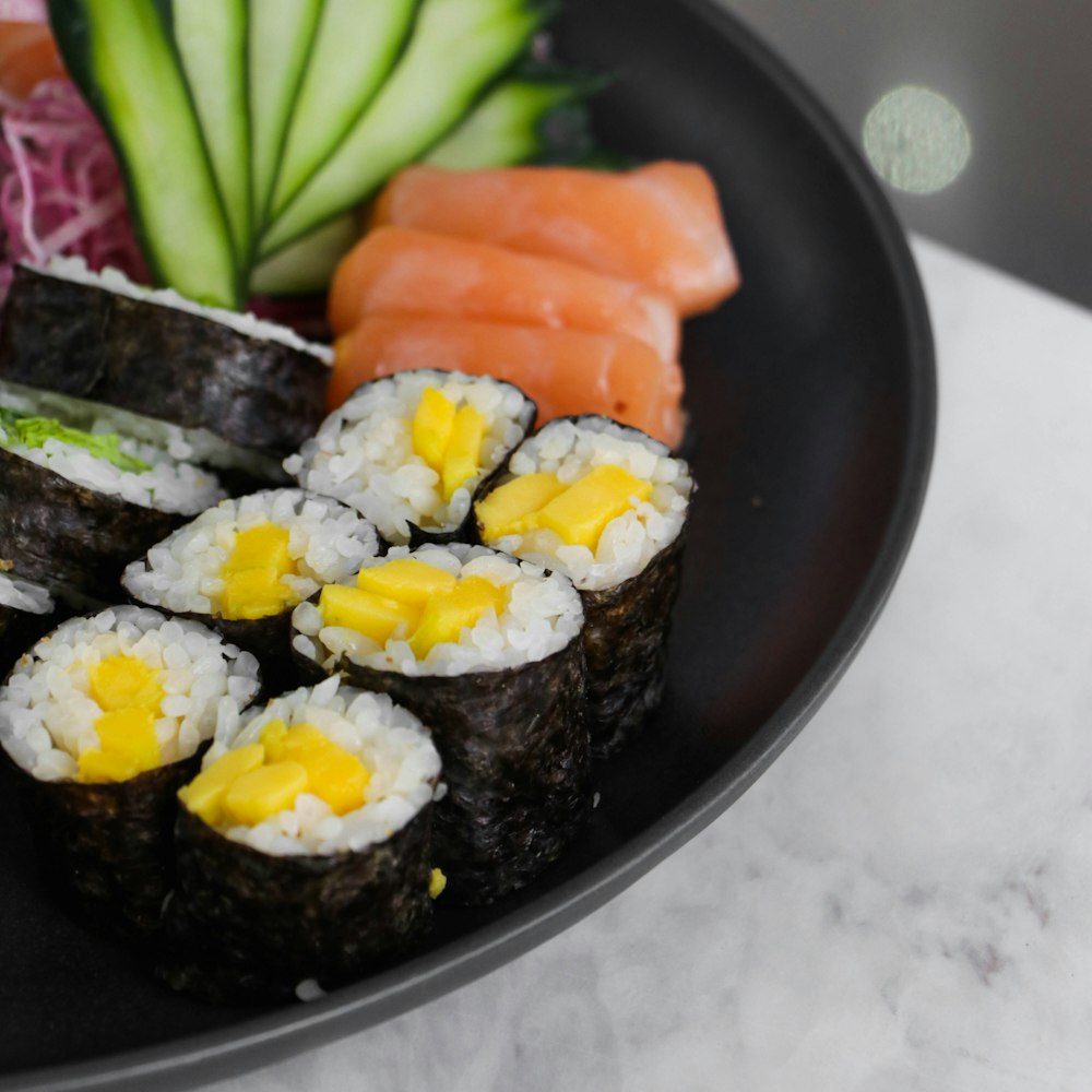 sushi on black ceramic plate