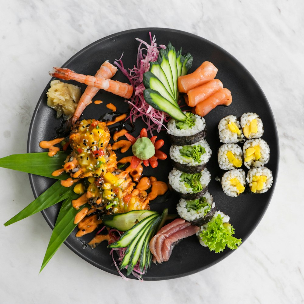 sliced cucumber and carrots on black ceramic plate